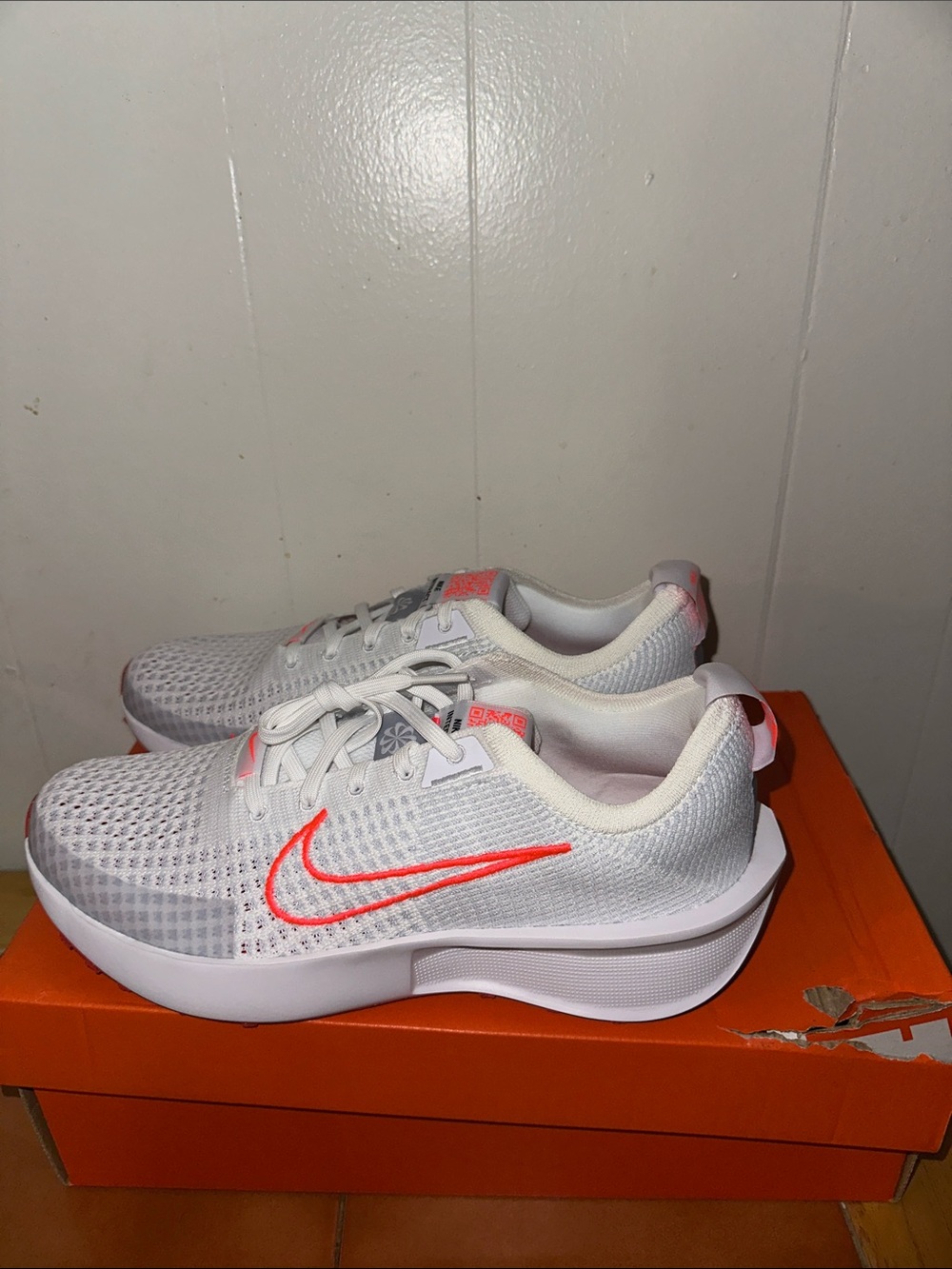 Nike White Athletic Sneakers with Neon Coral Swoosh